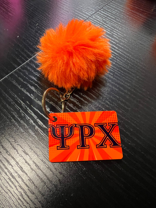 Keychain with orange pom pom